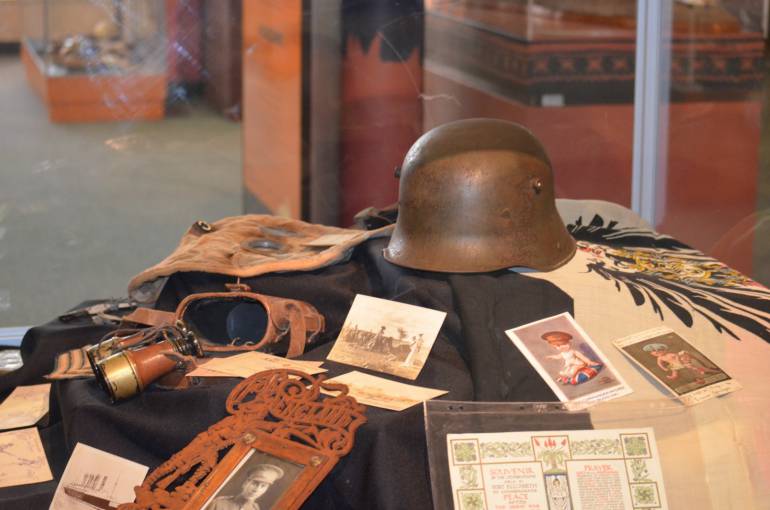 The exhibit includes artefacts from the Museum’s collection including an original WWI German officer's helmet